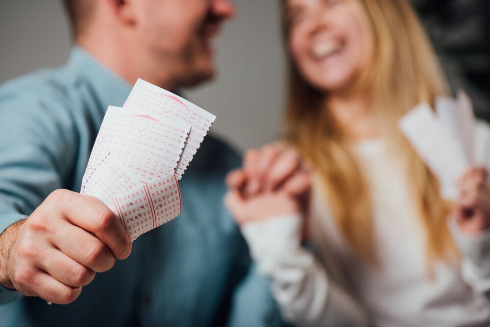 Cropped,view,of,happy,man,and,woman,holding,hands,while